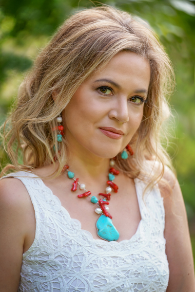Turquoise Coral Muse jewellery set shown on a model